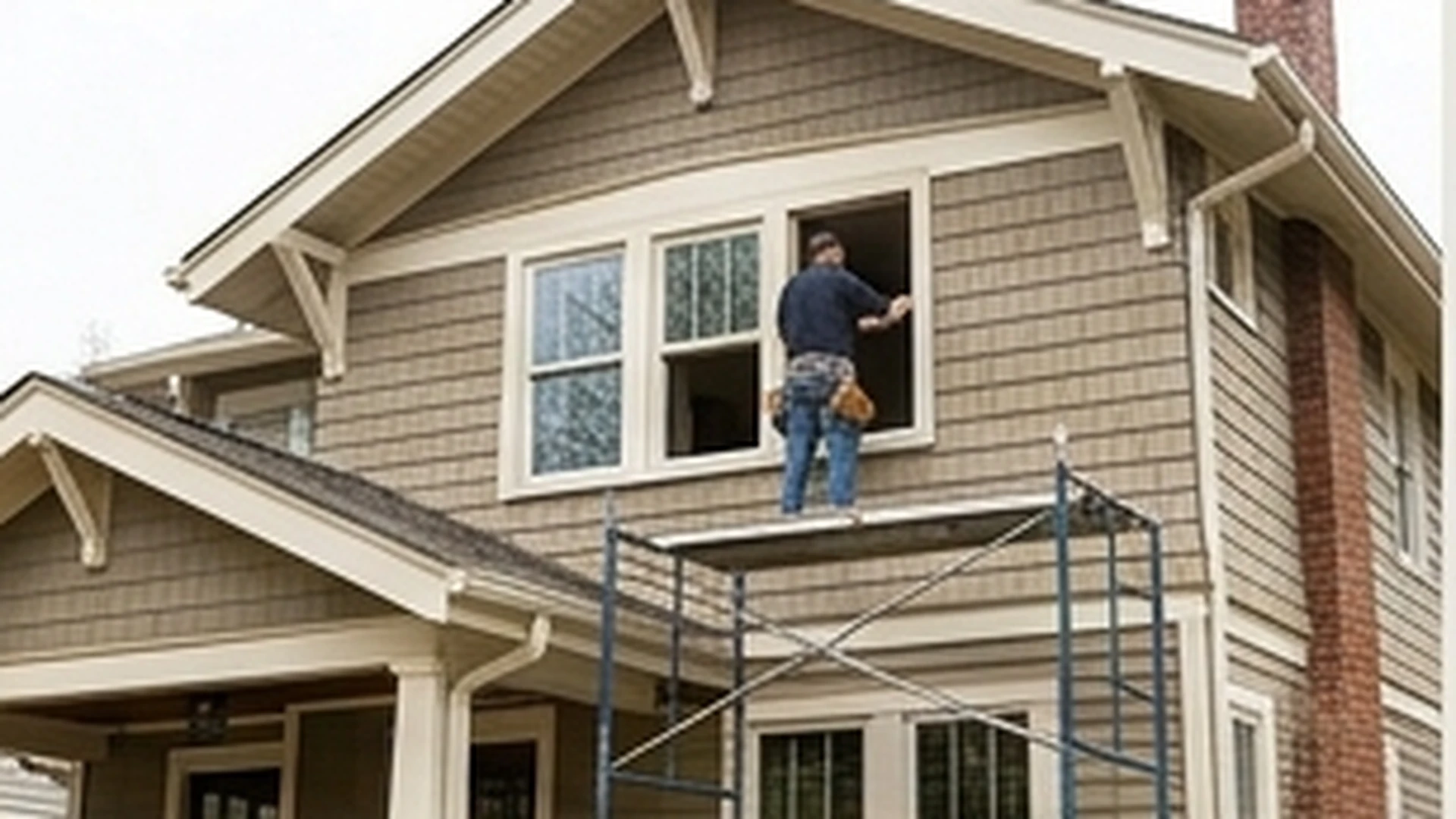 Replacement windows being installed in a frederick home exterior opening